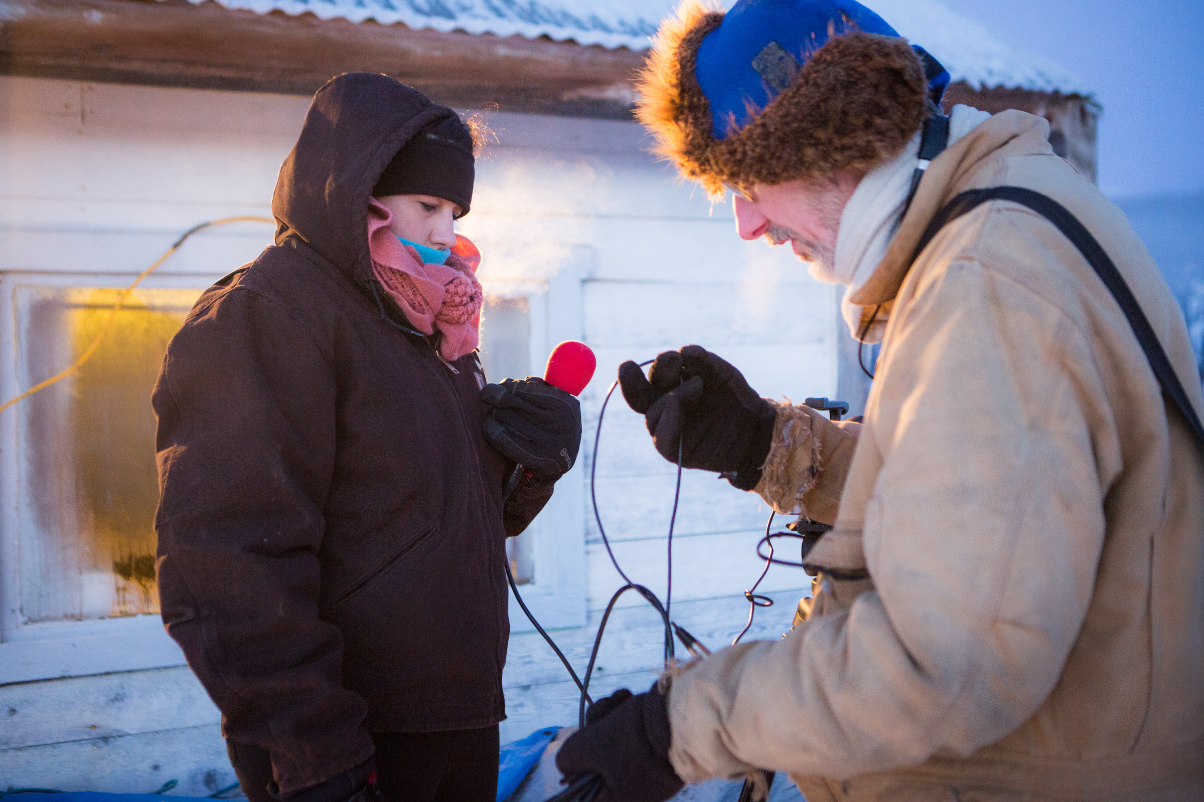 Monica Combs and journalism professor Brian  O'Donoghue prepare to interview mushers from the 2014 Yukon Quest at the Mile 101 checkpoint.