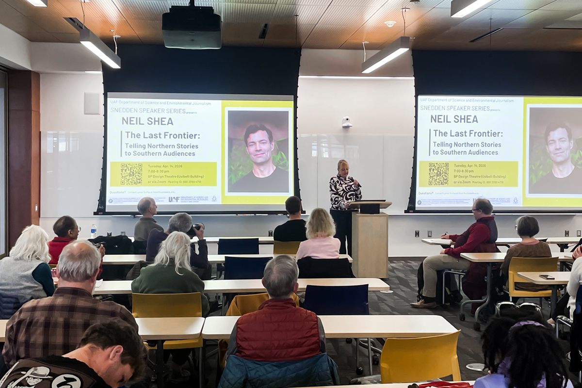 Department Chair Lynne Snifka introduces Snedden guest speaker Neil Shea. UAF Photo by Masek Kroening
