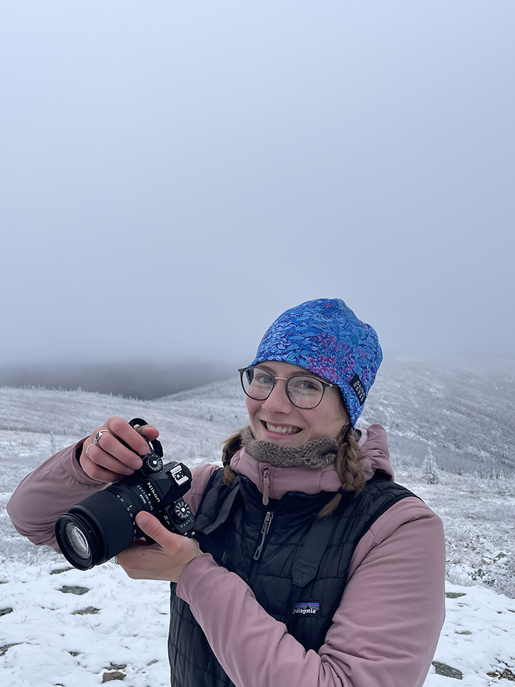 Lizzy Hahn holding a camera. Photo credit: Gwen Lockwood