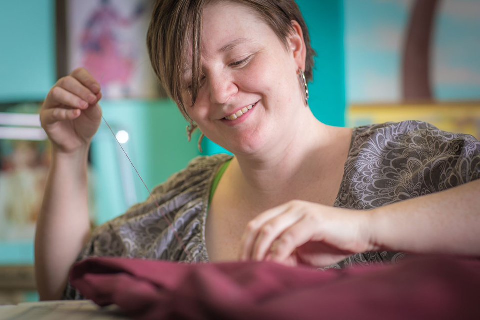 Student employee and theatre major Stephanie Sandberg enjoys sewing as part of her job in the costume shop at Theatre UAF.