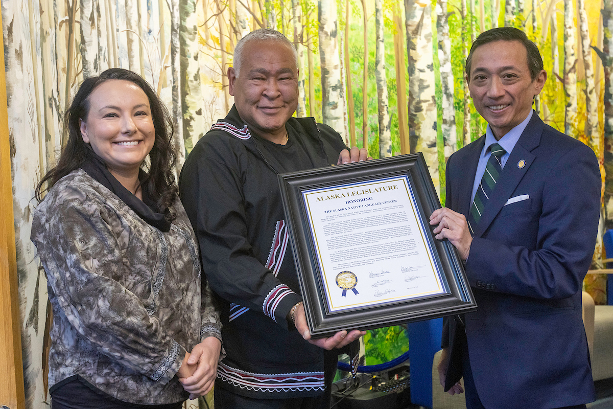 Rep. Scott Kawasaki, right, presents Alaska Native Language Center director Walkie Charles, center, and Charlene Stern, Vice Chancellor for Rural Community and Native Education, left, with a Legislative proclamation honoring the Alaska Native Language Center as the ANLC celebrates its 50th Anniversary in the Wood Center at UAF Tuesday, October 4, 2022. | UAF Photo by Eric Engman