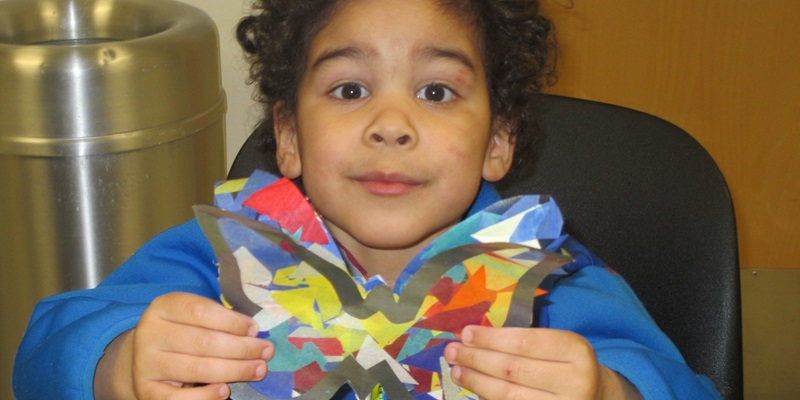 Child with butterfly craft