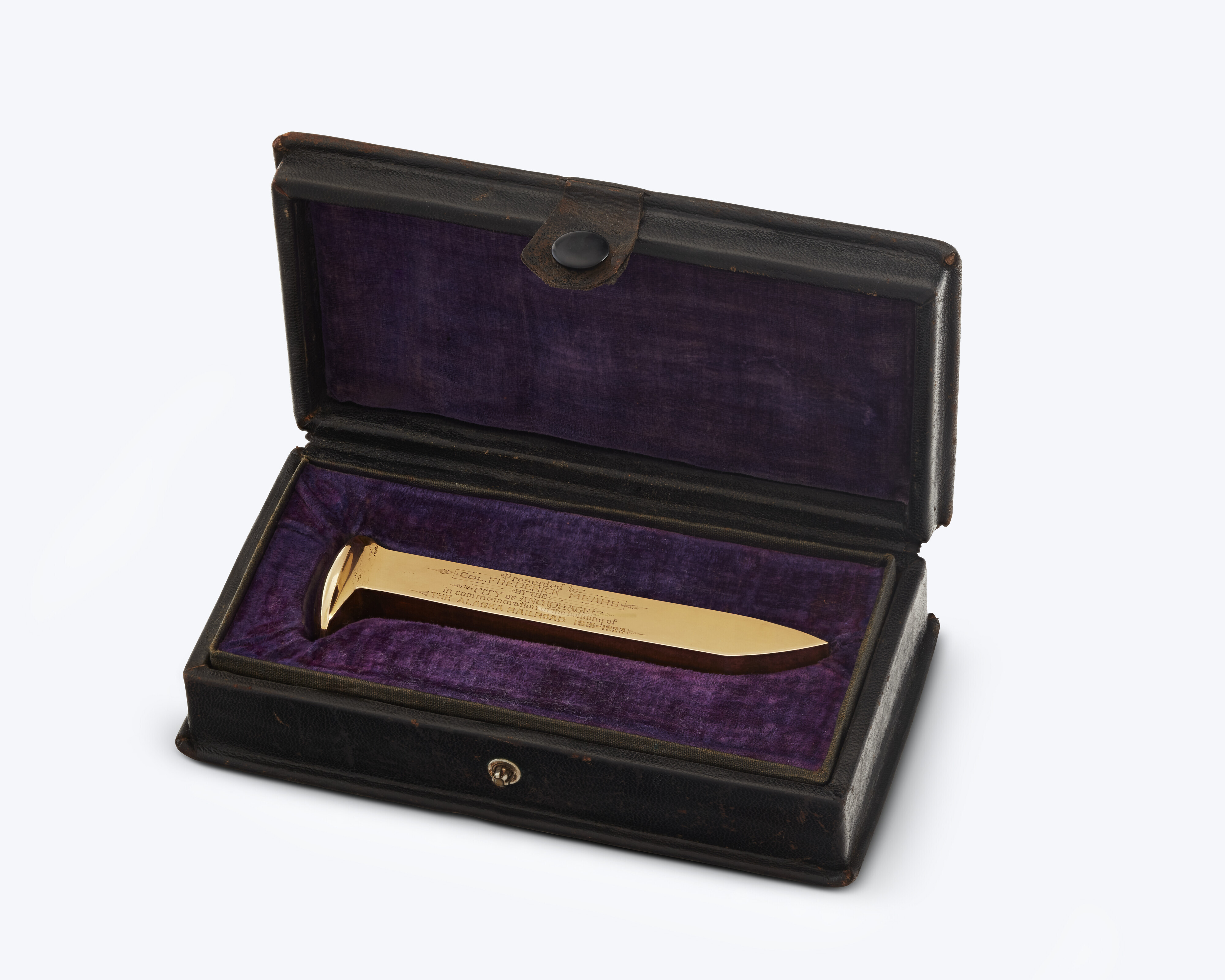 golden railroad spike in box