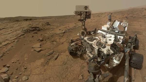 The Curiosity rover on the surface of Mars.