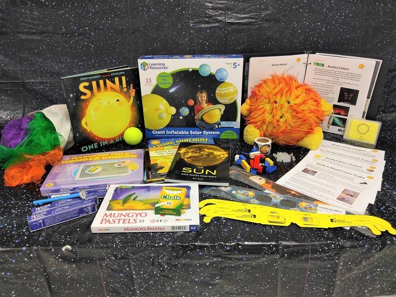 Sun Discovery Kit contents against a starry background.