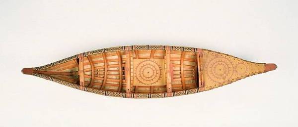 Model canoe made from wood, birch bark, and root.