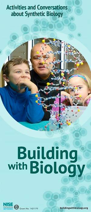 An adult and two children looking at a DNA model. 