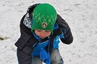 Child exploring in snow.
