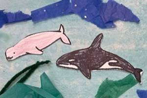 Collage showing an underwater scene, made with watercolors, yarn, and tissue paper. Several colored whale templates are glued to the collage.