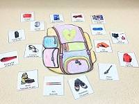 Backpack Example: A backpack template colored with crayons, with pictures of various items arranged around it.