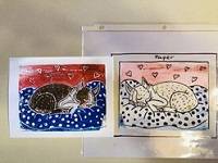 Print of a brown dog sleeping on a bed, against a red and blue background. A foam piece with the same design is next to the print.