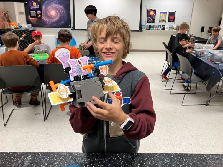 Camper with spacecraft model