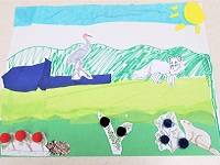 Collage of animals and berries in a tundra landscaoe, made with construction paper, tissue paper, and pompoms.