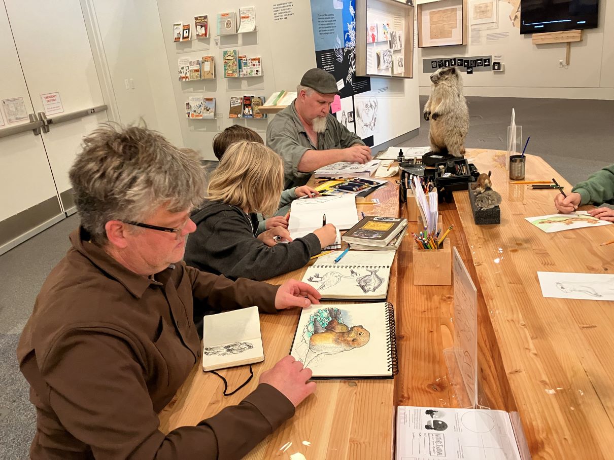 Museum guests sketching with artist Jamie Smith