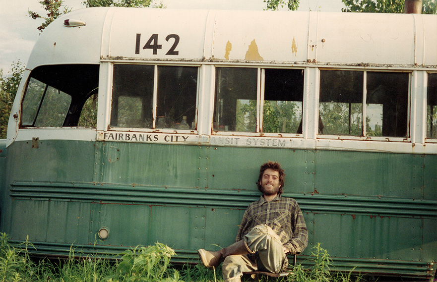 Chris McCandless sits by Bus 142 Chris McCandless sits by Bus 142