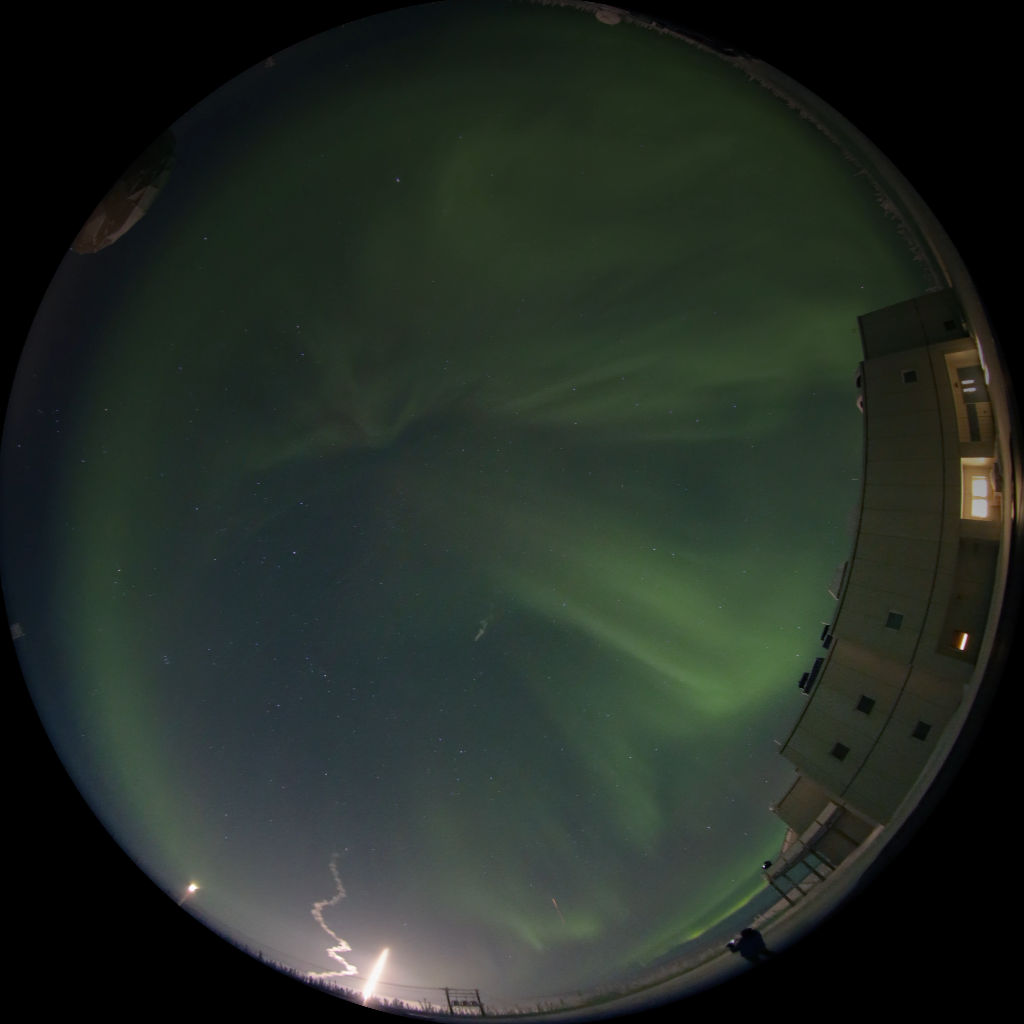 Fulldome image of a rocket launching into the aurora at Poker Flat Research Range