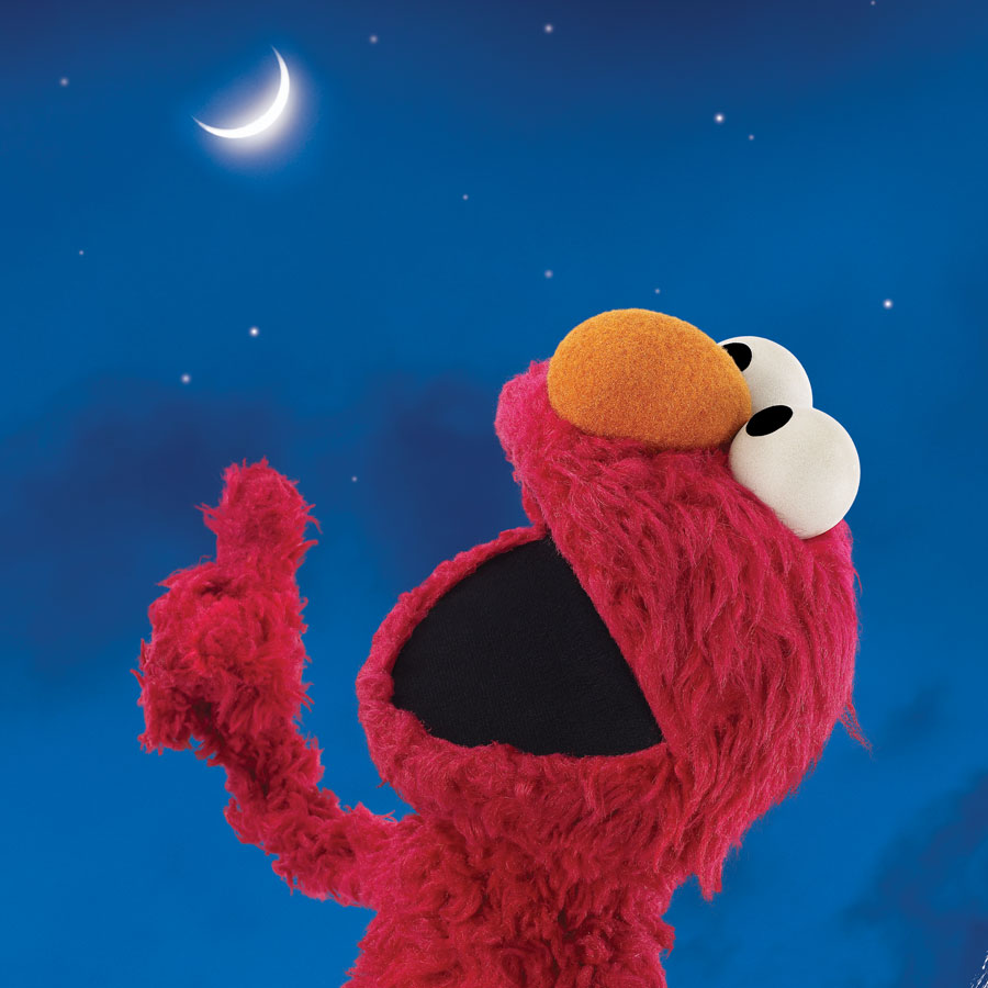 Elmo muppet looking at the moon
