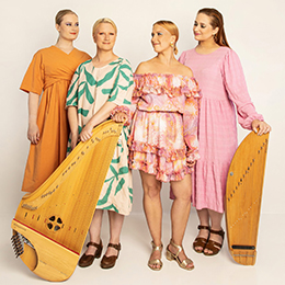 The four women of Kardemimmit posing with two kanteles | Photo by Katariina Salmi taken from artists' website