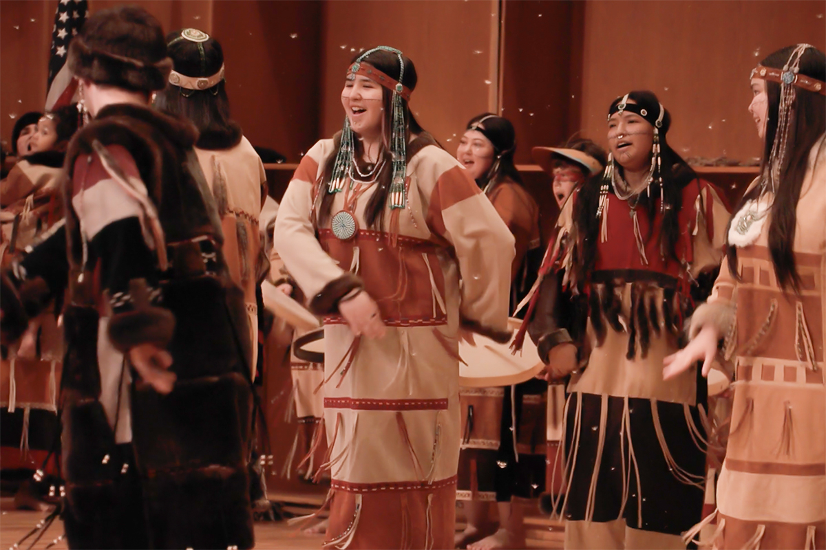 Atka dancers on stage in the UAF Davis Concert Hall during the 2025 Festival of Native Arts. Still from a UAF video.