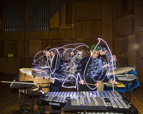Percussion players leaving light trails while they play | UAF Photo by JR Ancheta