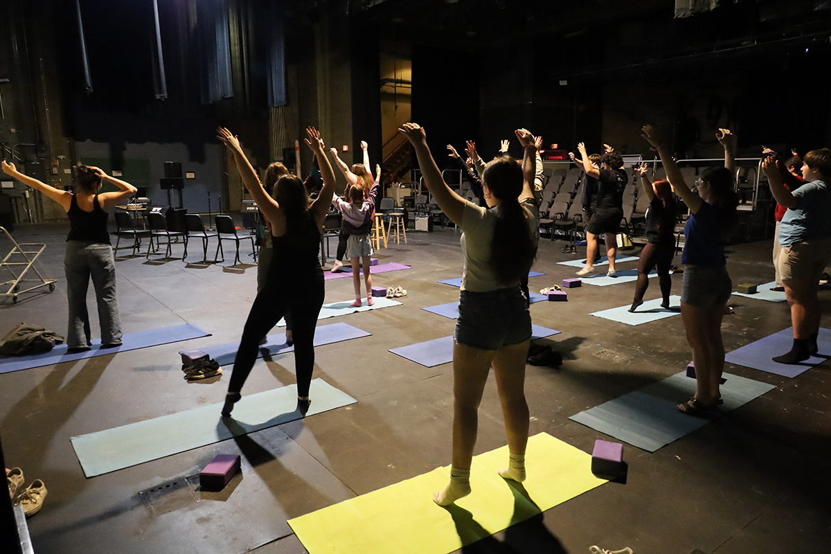 Students from the body movement class stretch on yoga mats. Summer Music Academy 2026. UF Photo by Jaunelle Celaire