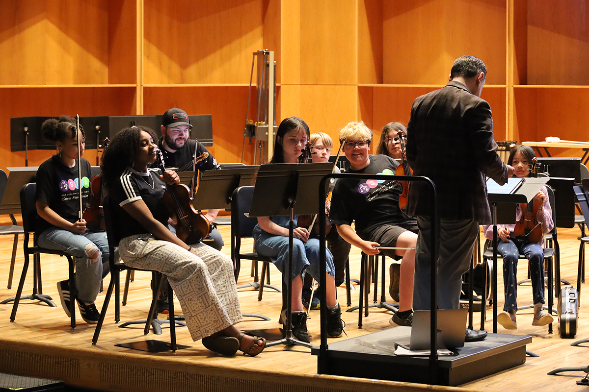 Students playing violins under the direction of Daniel Strawser during a 2026 Summer Music Academy practice. UAF Photo by Jaunelle Celaire