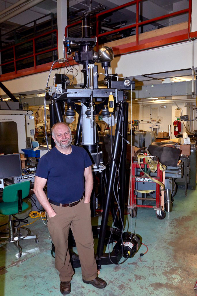 Photo courtesy of Mark Conde Mark Conde, a space physicist at UAF's Geophysical Institute, stands next to the scanning Doppler imager. Conde thought up the device, which is heading to Antarctica.