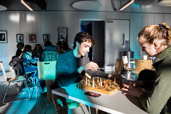 Michael Martins playing chess in the UAF Wood Center Arctic Java coffee shop
