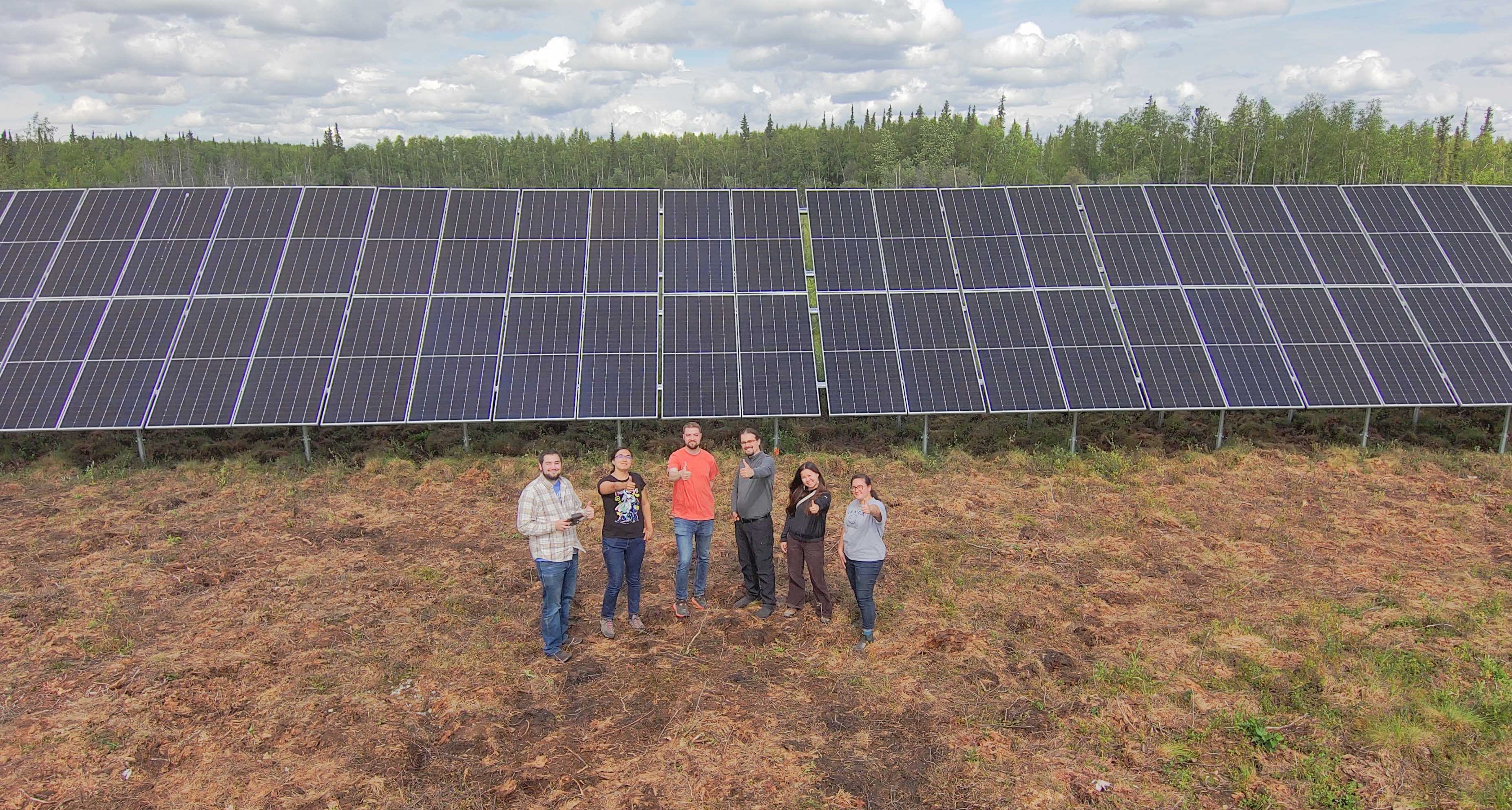 Drone selfie of ACEP team members and Kartorium founders at the new solar array in Galena, Alaska.