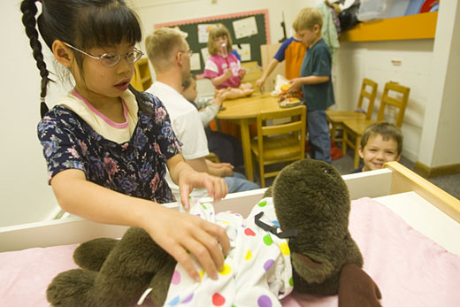 Hannah Powell tends to the needs of a moose friend at the Bunnell House Early Childhood Lab School.
