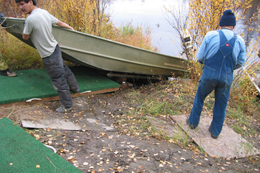 Boat being used on modular pieces of decking designed by Curtis Knight.