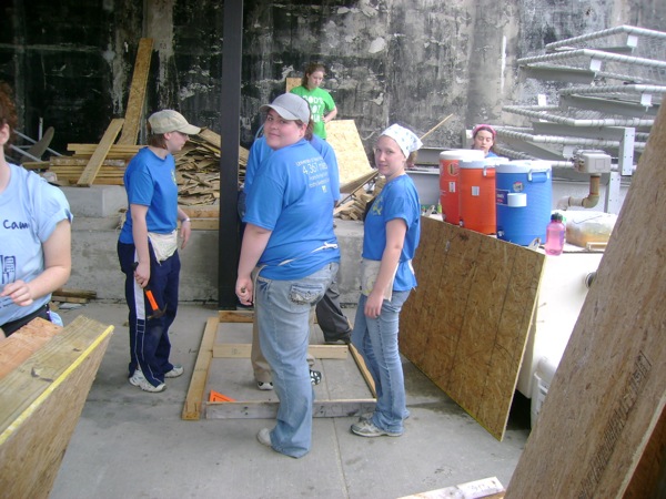 Renee Pasker'left to right', Erica Milstead, Cynthia Lashinski and Clarissa Ribbens work together to build bunk beds. Photo by Erica Schooley