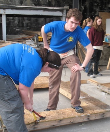 Brian Lyke observes as Kari Pile works. Photo courtesy UAF Leadership Program