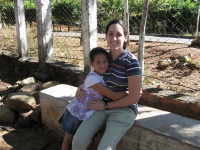 Erin with a friend outside