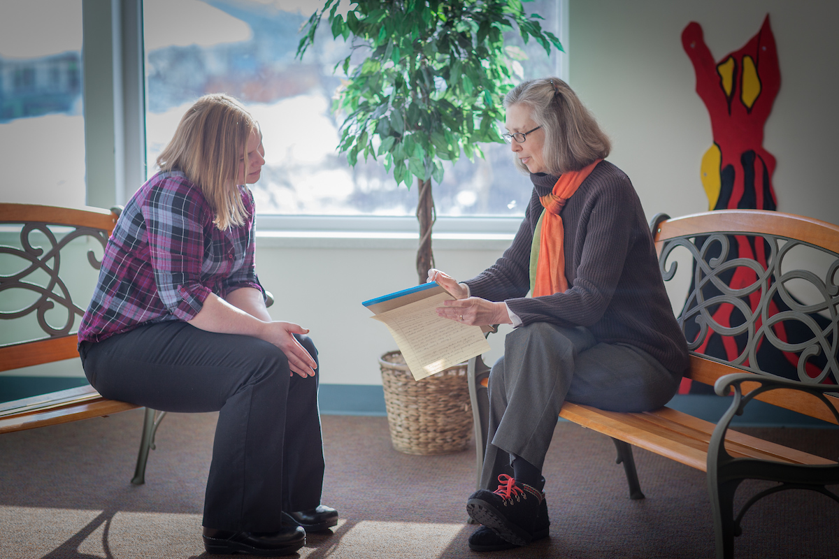 Education major Jamie Hallberg, left, meets with mentor Kathie Cook while completing her internship at Denali Elementary School in Fairbanks.