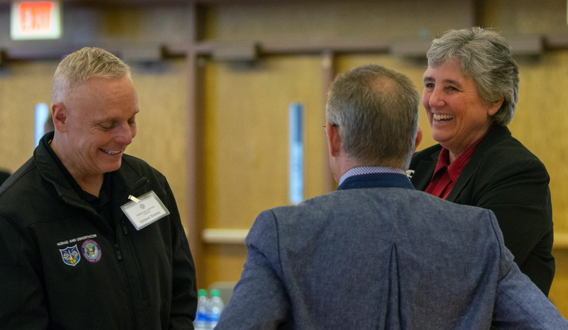 Rear Adm.Dan “Undra” Cheever, the U.S. Northern Command’s director of strategies, policies and plans, at left, talks with University of Alaska President Pitney, at right, and  Daniel Neuffer, the U.S. European Command’s Arctic strategist.