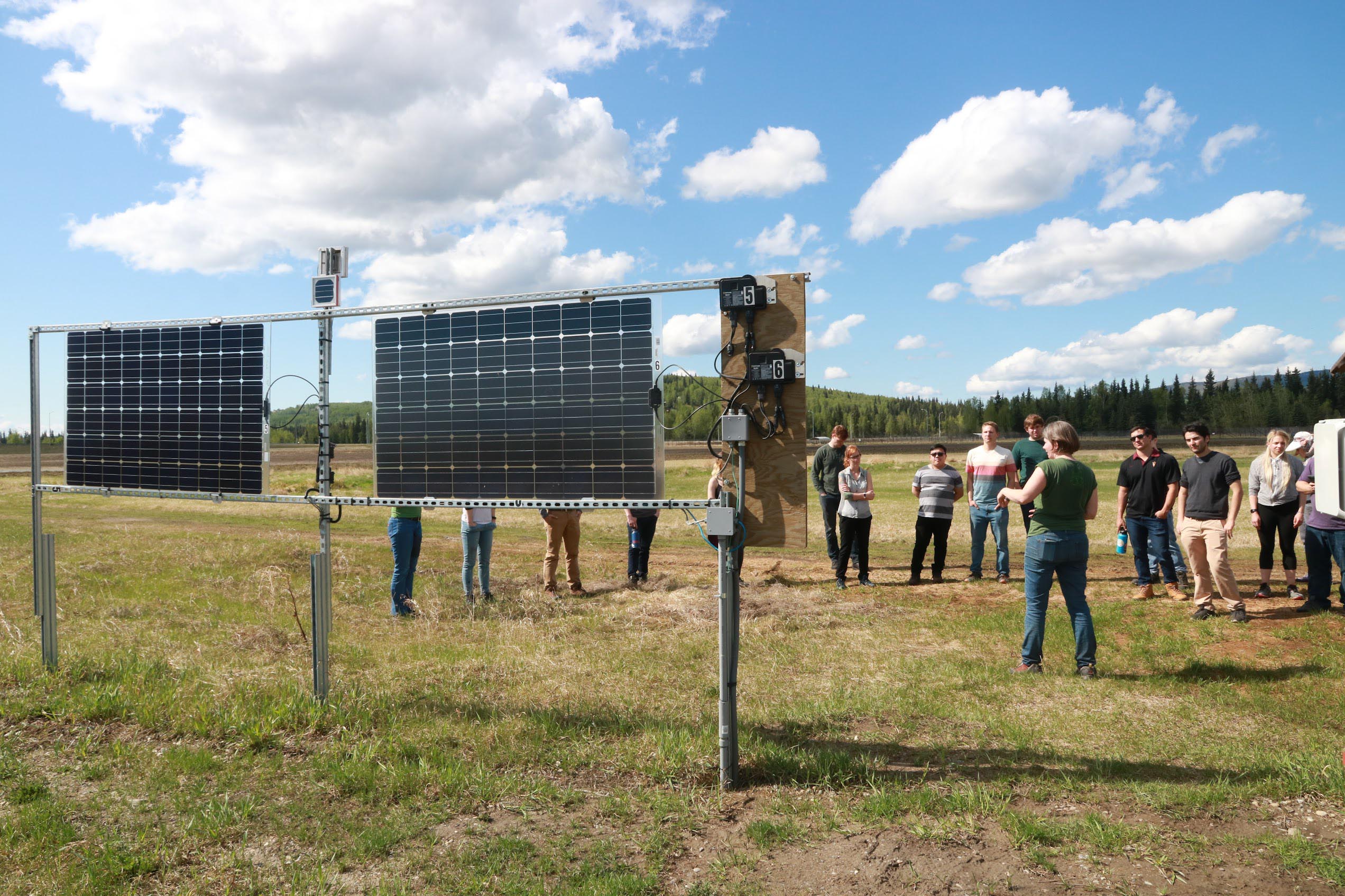 Students stand at ACEP Solar Test Site