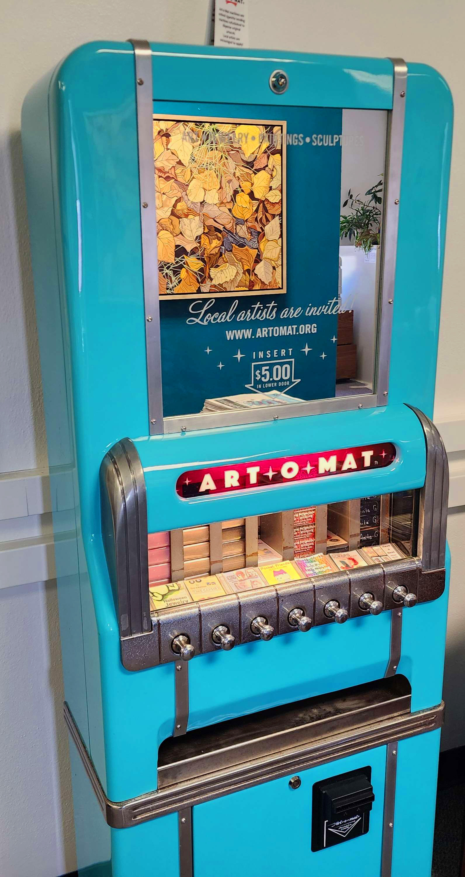 Art-O-Mat machine featuring small works of art for sale.