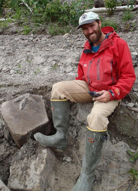 Patrick Druckenmiller collecting dinosaur tracks along the Yukon River.