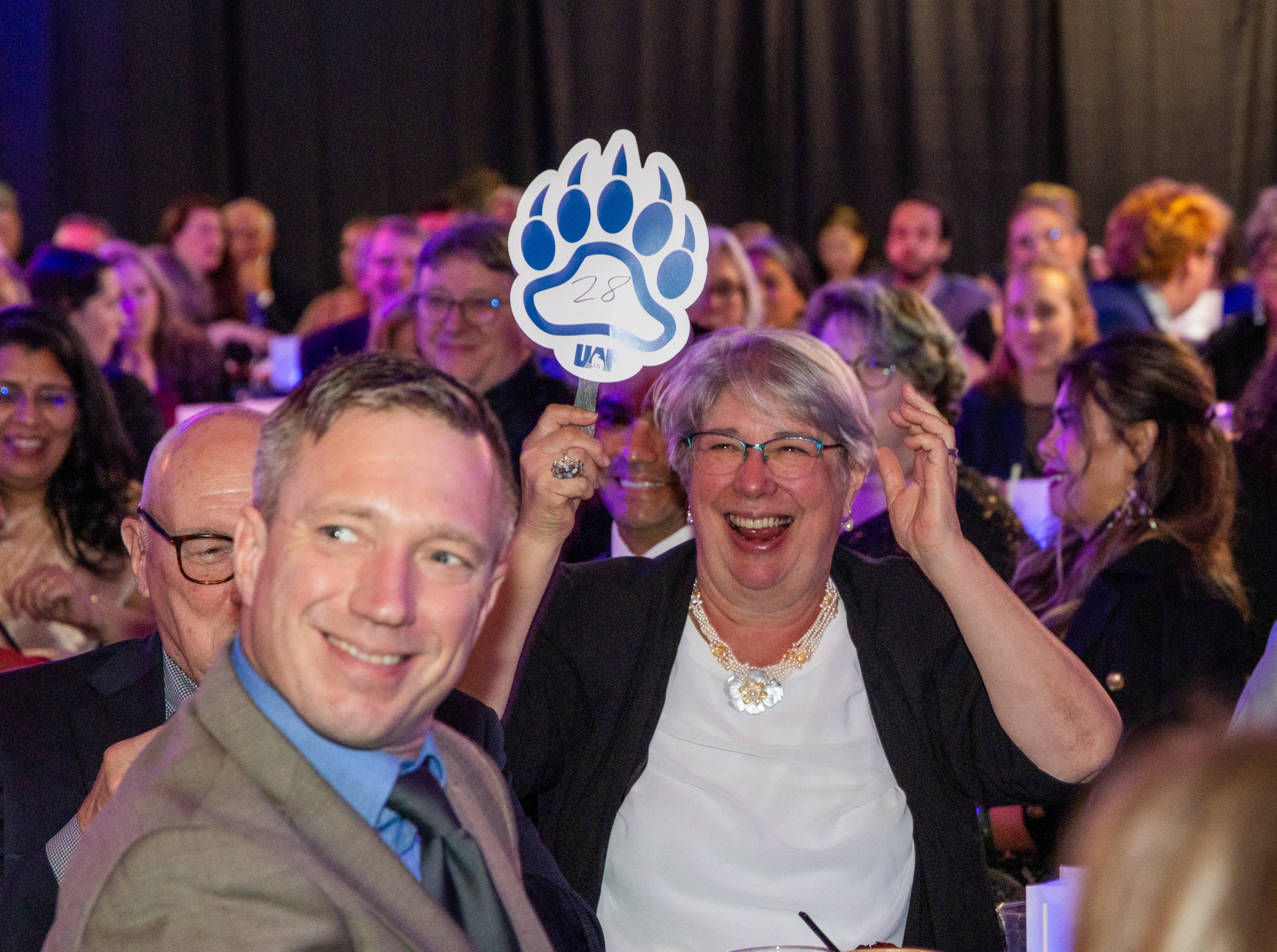 Karen Perdue makes a bid during the Blue & Gold Banquet and Fundraising Auction.