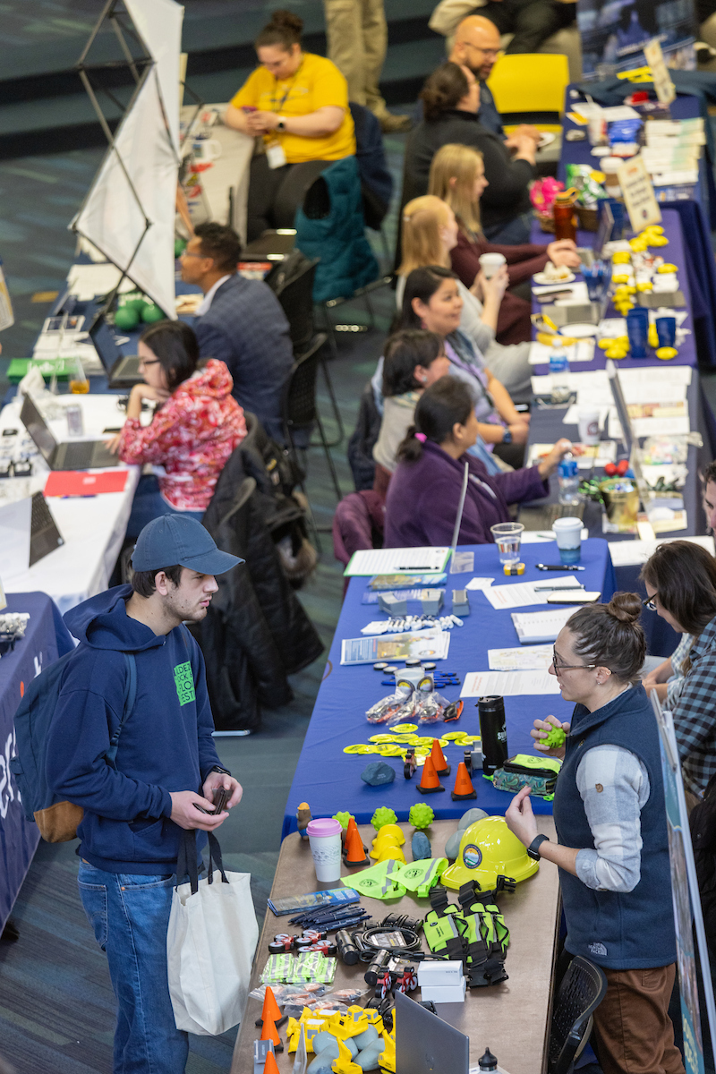 Students network at the Fall Career Fair in the Wood Center on the UAF campus on Oct. 10, 2024.