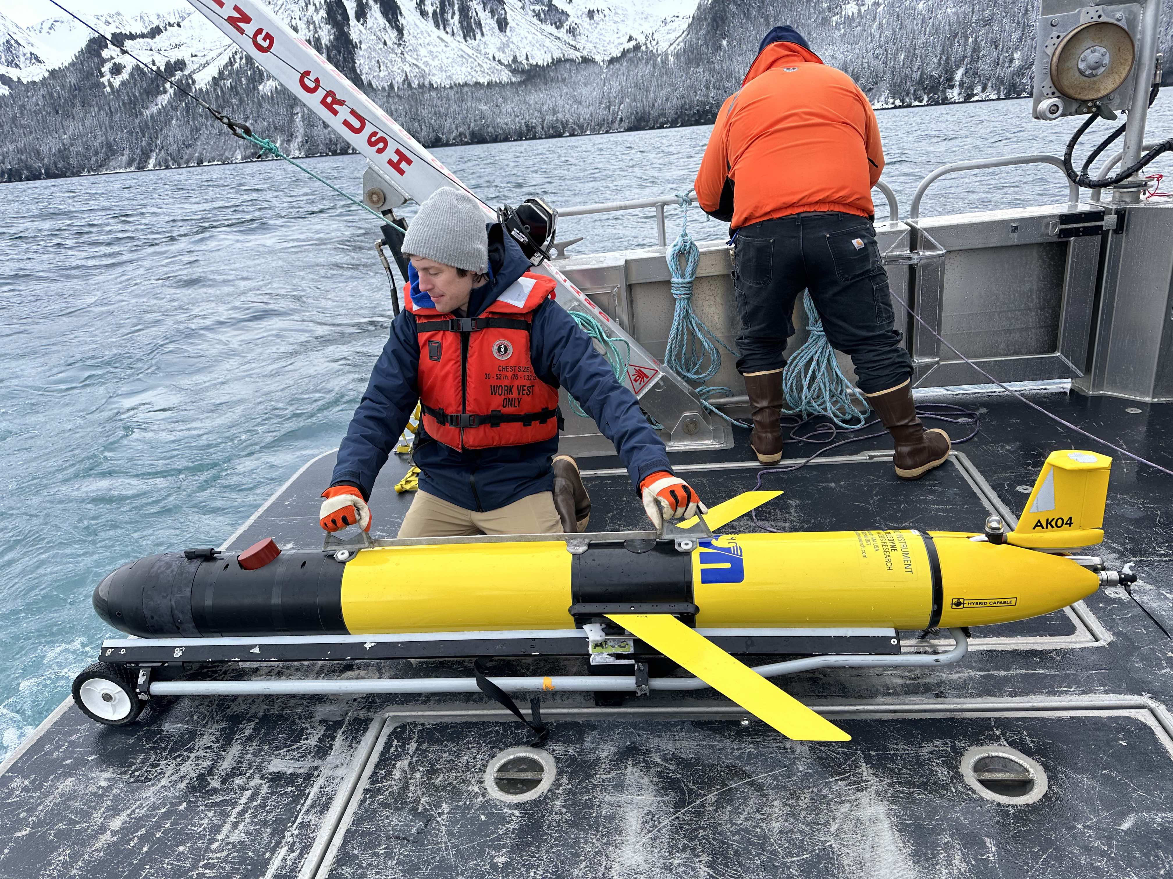 Tyler Hennon, a research assistant professor at the UAF College of Fisheries and Ocean Sciences, prepares to launch Gretel into Resurrection Bay in spring 2023.