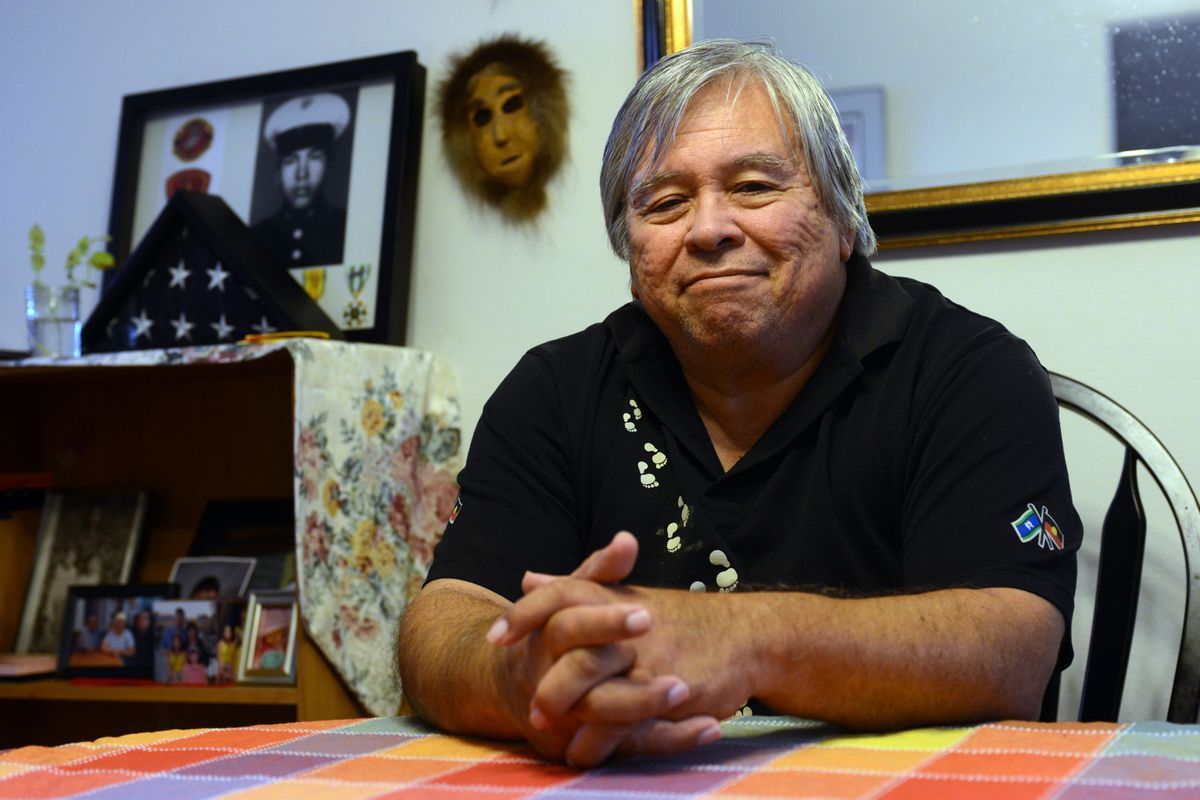 a man sits at a desk