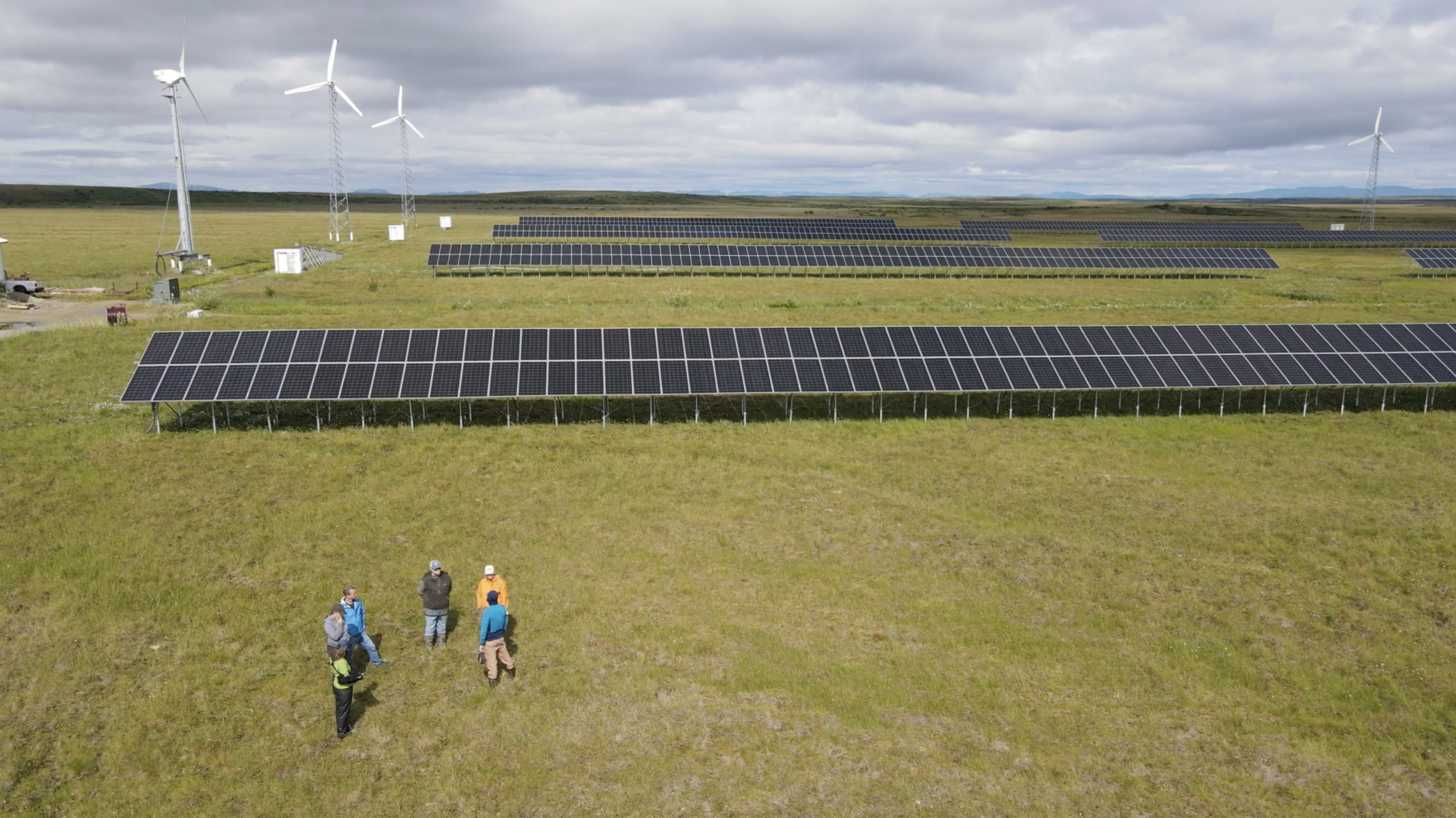 A landscape photo shows Kotzebue's solar array and wind turbines.