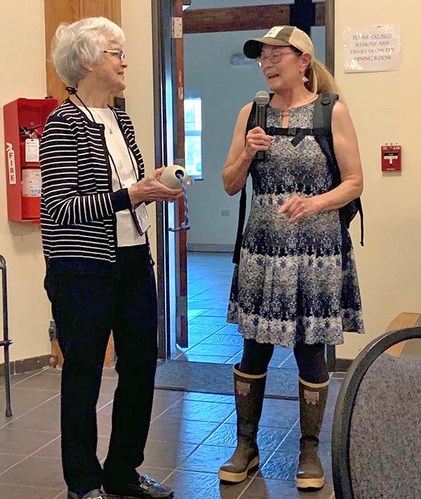 Woman speaks into a microphone