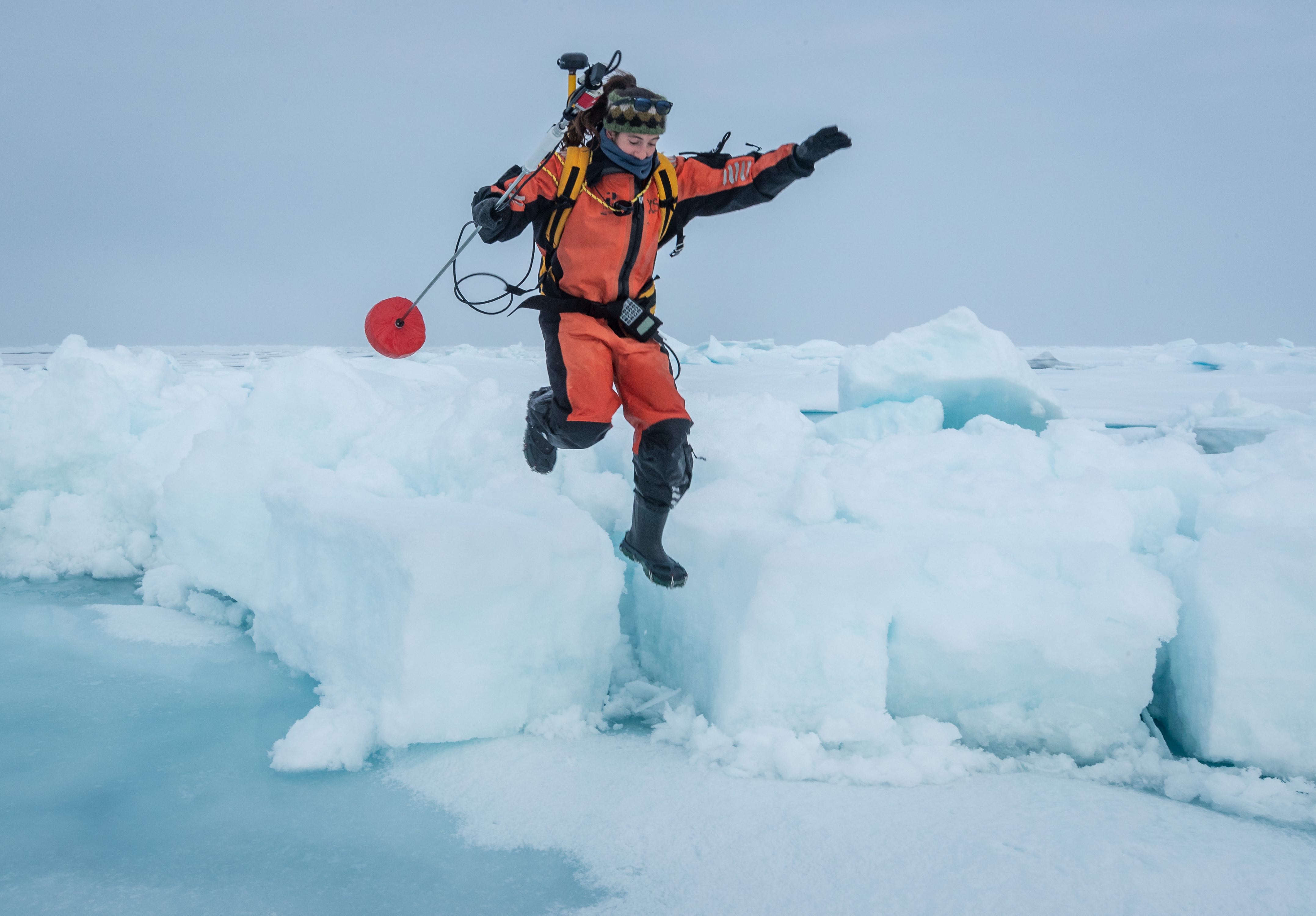 Melinda Webster jumping into melt pond.