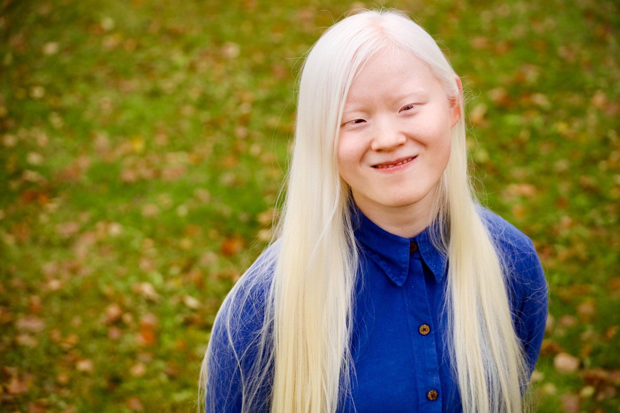 Smiling woman with a green nature background
