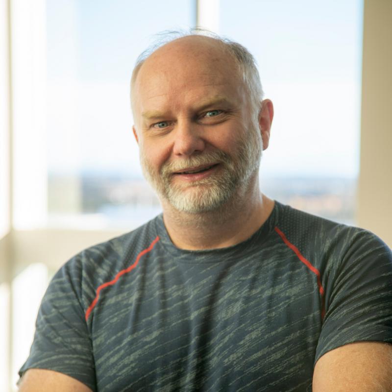 Portrait of a bearded man wearing athletic style tshirt indoors