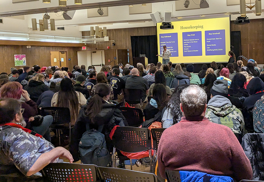 Florence Scott, program manager for Educators Rising Alaska, gets participants ready for a day of activities at the Ed Rising Alaska State Leadership Conference’s opening ceremony.