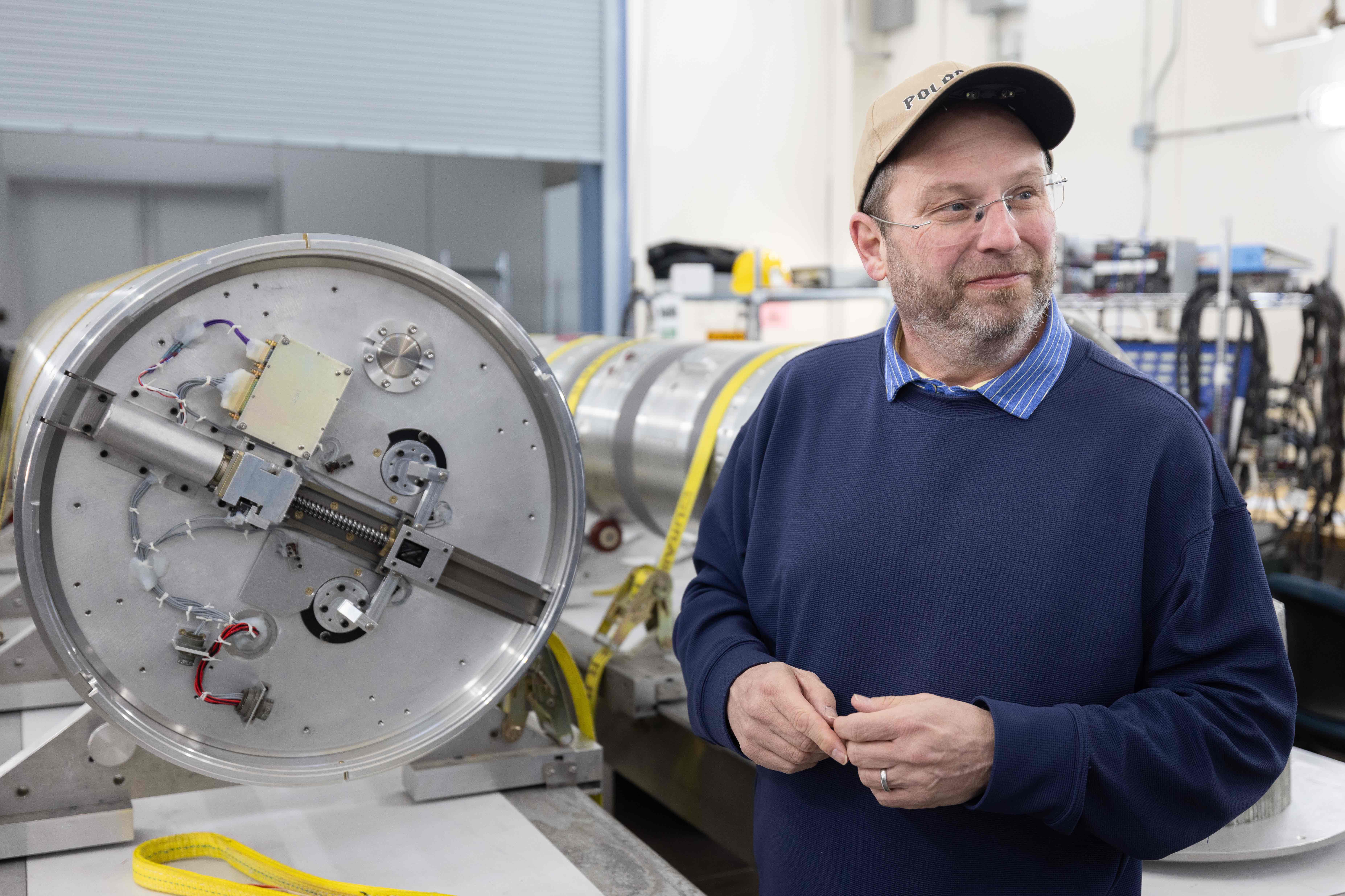 Scott Bailey of Virginia Tech stands with a portion of the rocket for his Polar Night Nitric Oxide, or PolarNOx, mission at Poker Flat Research Range north of Fairbanks. Photo by Bryan Whitten